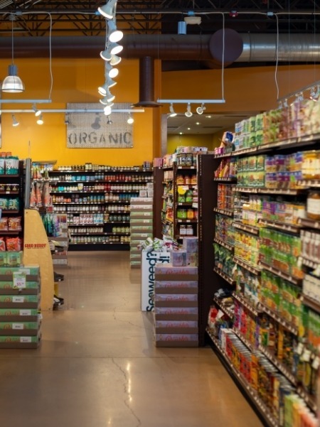 Bright, clean grocery aisles at Nature's Oasis health food store in Durango, fully stocked with organic products.