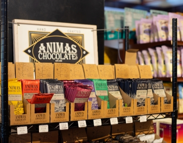Shelves stocked with local artisan goods at a natural grocery store in Durango.
