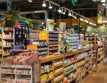 Certified organic multivitamins and minerals alongside immune support and seasonal wellness bottles on a shelf.
