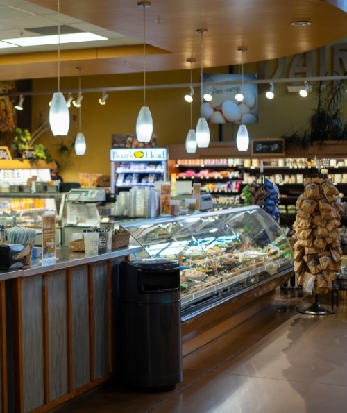 Fully stocked grocery store shelving inside Nature's Oasis, your destination for healthy food in Durango.