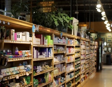 A wide selection of clean body care and organic beauty products on shelves.
