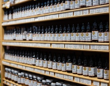Natural vitamins and supplements in Durango featuring liquid herbal remedies, tinctures, and probiotics for digestive health support.