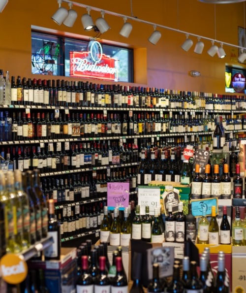 Durango Liquor store shelves stocked with beer, wine, and spirits.